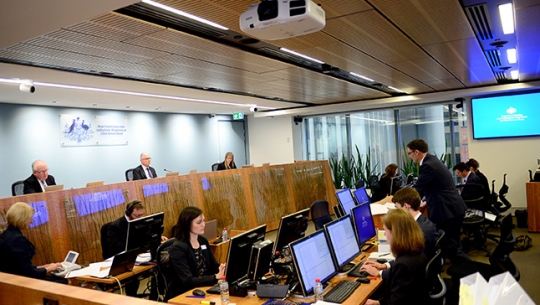 Interactions between children within schools public hearing A crowded hearing room with Commissioners sitting in the distance