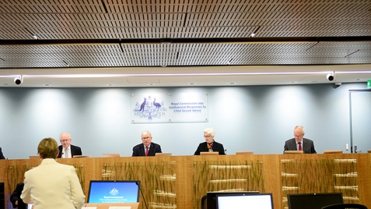 Case Study 25: Redress and civil litigation public hearing The full bench of Commissioners sitting and listening to Counsel Assisting Gail Furness SC