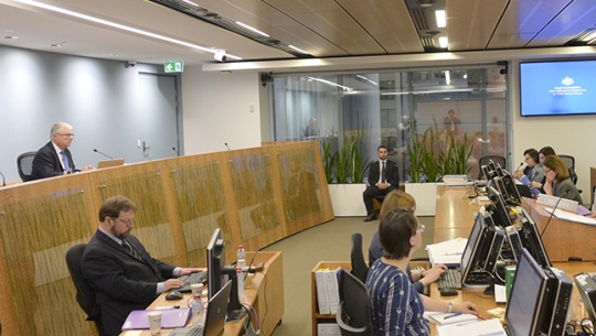 Retired Catholic Bishop Geoffrey Robinson public hearing From left: The Hon. Justice Peter McClellan AM sitting at the bench facing rows of legal team members at a public hearing