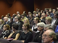 Rows of people sitting in a lecture theatre